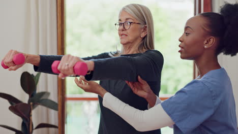 Woman,-physiotherapist-and-wellness-with-dumbbells