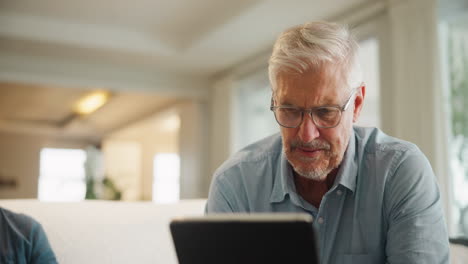 Grandfather and Grandson Using Tablet Together