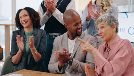 diverse team celebrates success in a meeting