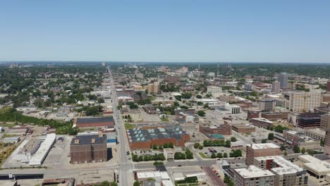 aerial pan right reveals omaha, nebraska skyline. daytime