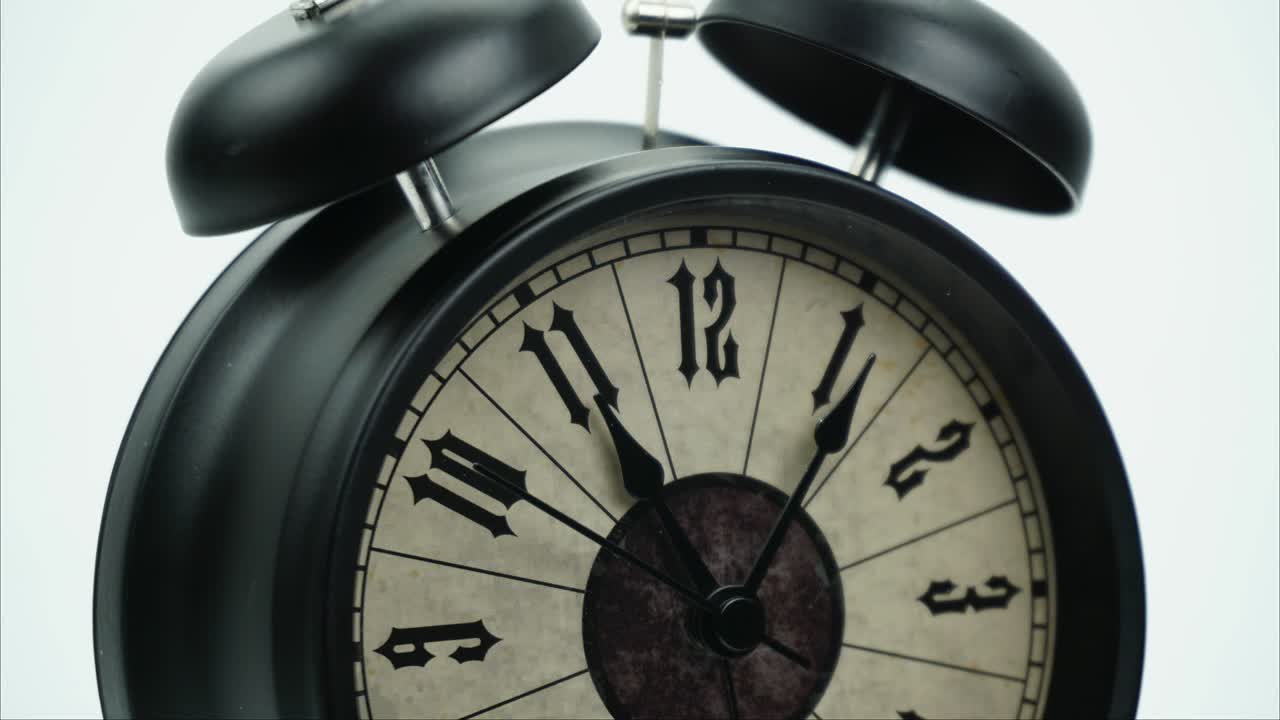 Classic Black Alarm clock isolated Showtime 10.45 am or pm.