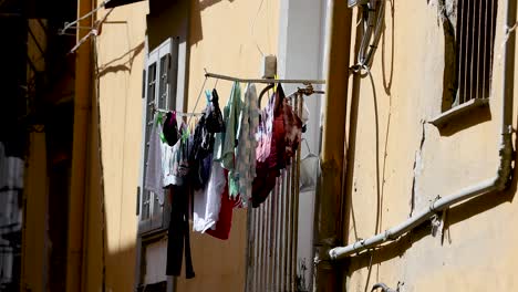 clothes hanging on a line outside building