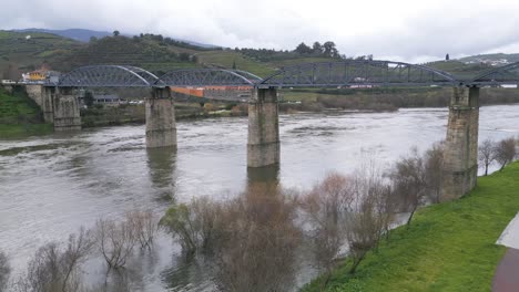 railway bridge over rio douro in peso da regua, portugal - aerial