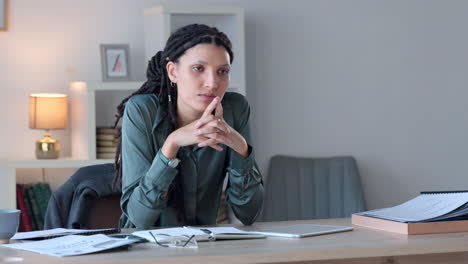 A-thinking-stylish-business-woman-sitting