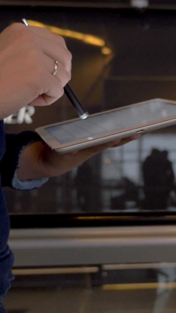 Using a Tablet Near a Vending Machine