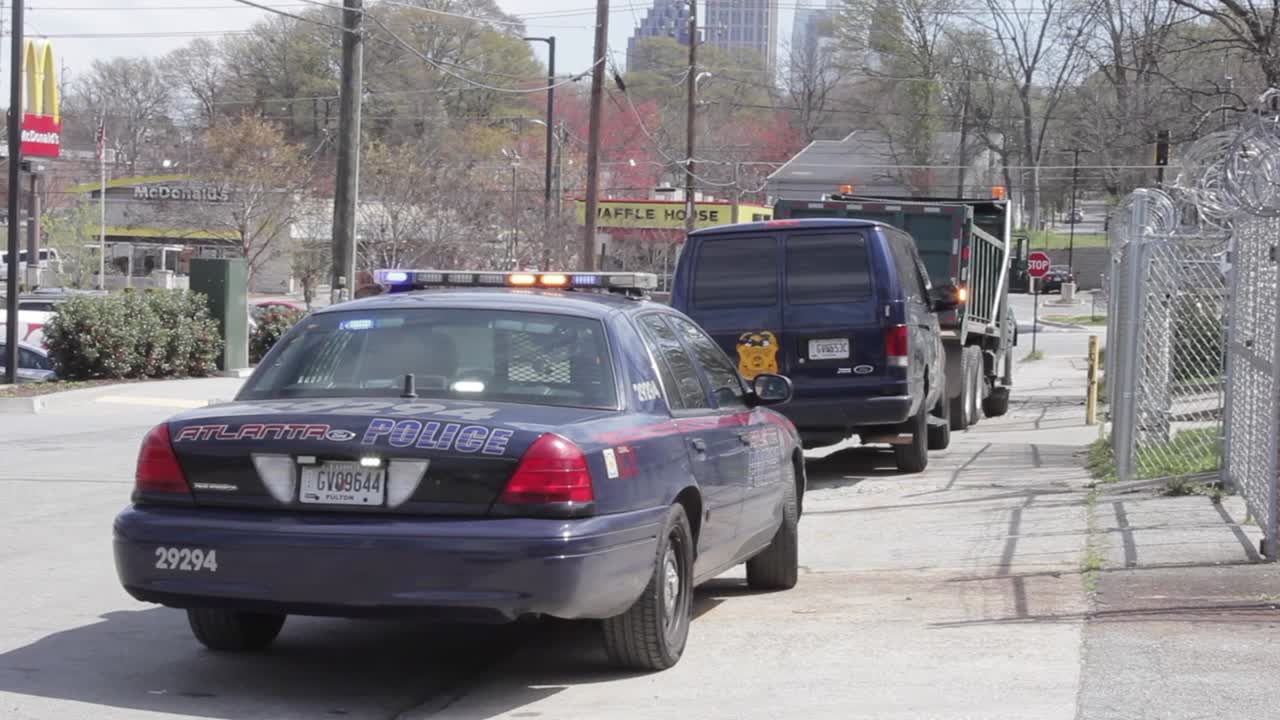 Atlanta Police cars parked with flashing lights