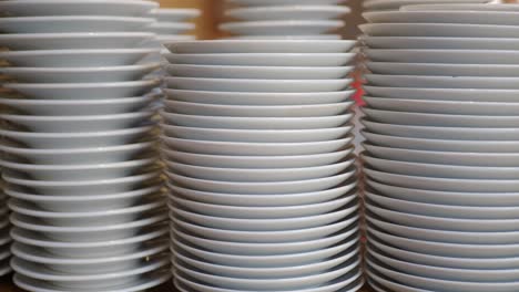 a stack of clean white plates