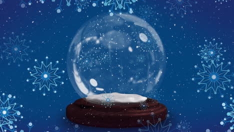 animación de copos de nieve navideños cayendo sobre un globo de nieve sobre un fondo azul