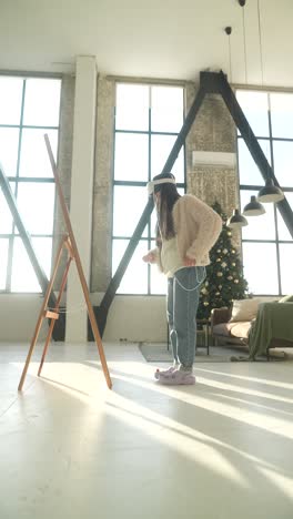 woman using vr headset in a modern home decorated for christmas