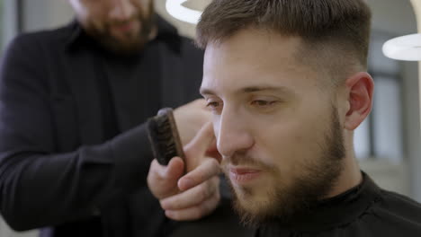 man getting a haircut at the barbershop