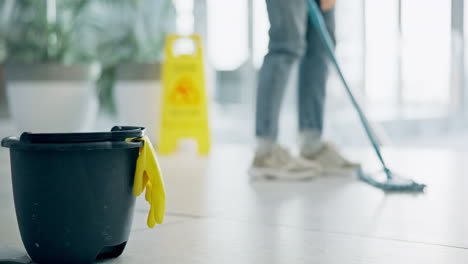 cleaning, bucket and person with mop in office