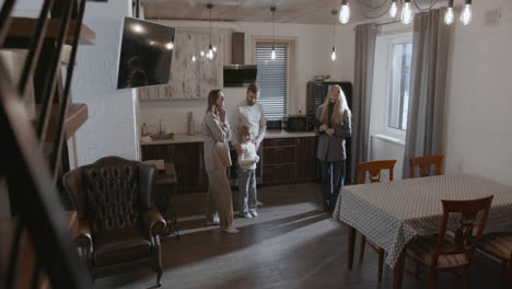 real estate agent showing house to family