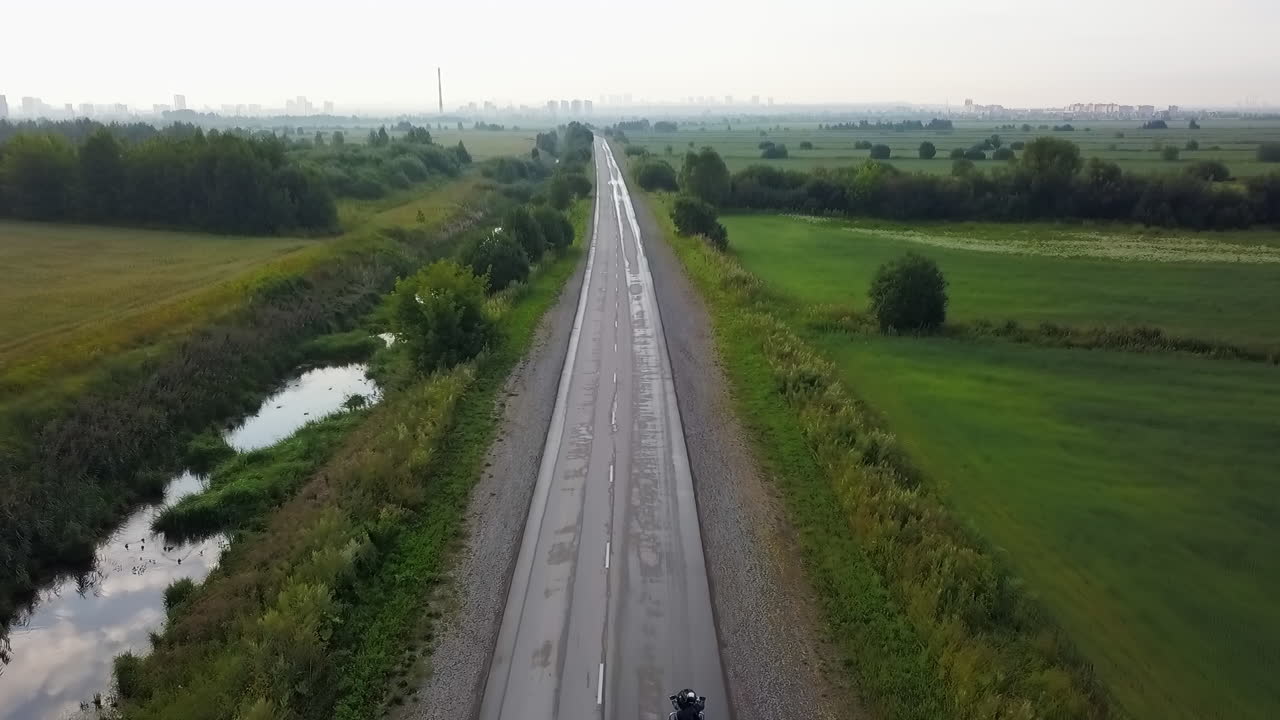 Aerial view of road through field