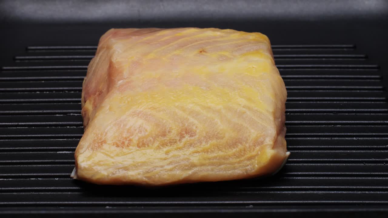 Raw Fish Fillet on a Grilling Pan