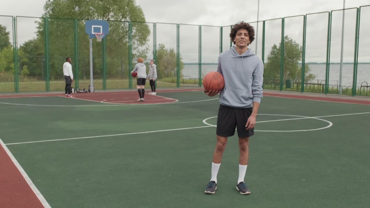 Basketball players on outdoor court