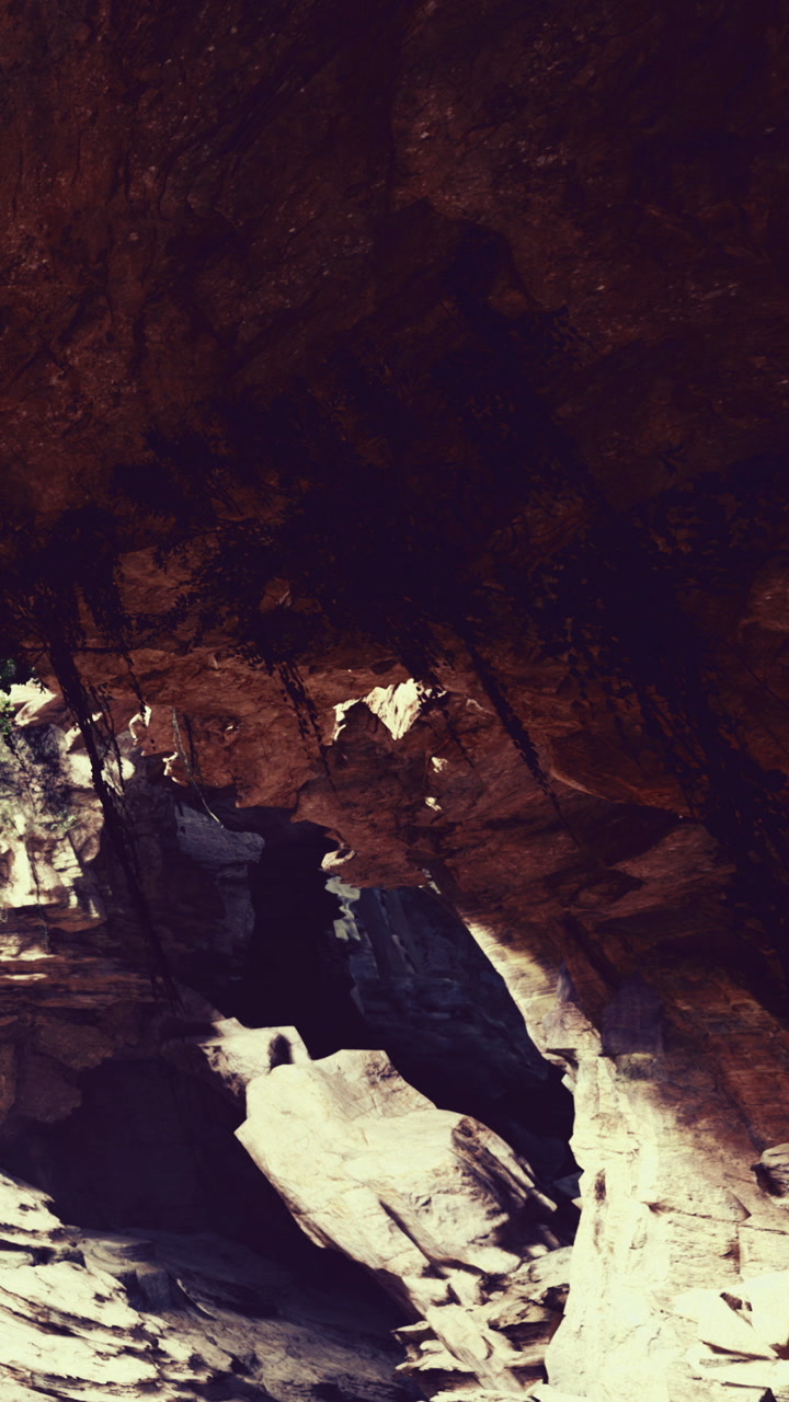 Exploring mystical rock formations under an ancient cave at sunset