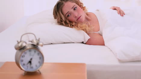 pretty blonde model refusing to wake up