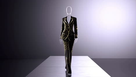 elegant black and gold patterned suit on mannequin on a runway