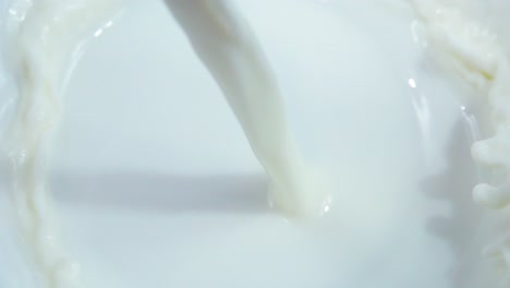 milk pouring into a bowl