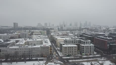 drone video of warsaw city skyline on a snowy and foggy day7