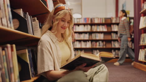 woman reading a book in the library