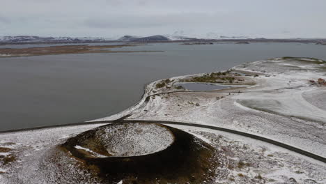 Aerial:-Backwards-reveal-shot-of-pseudocraters-in-Skutustadagigar-and-Hverfjall-volcano-in-Iceland