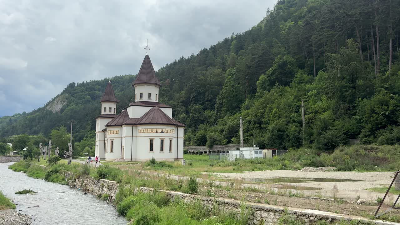Bran orthodox biserica by riverbanks in Transylvania, Romania