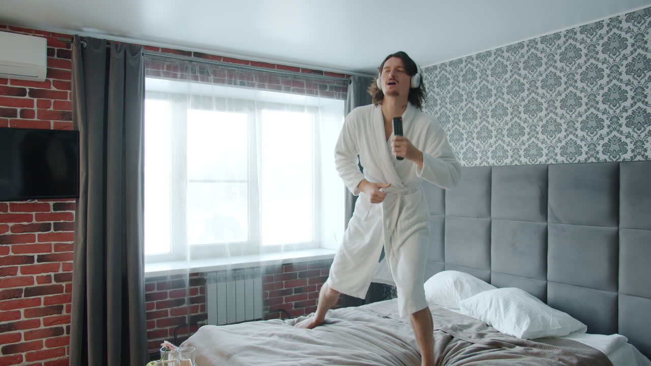 Man Dancing in a Hotel Room