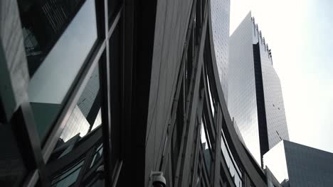 dark buildings in new york city, dynamic angle with a smooth motion.