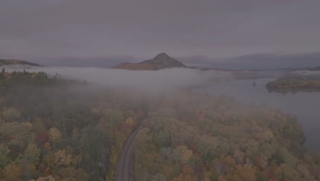 borestone mountain peaks above dense morning fog beside lake onawa