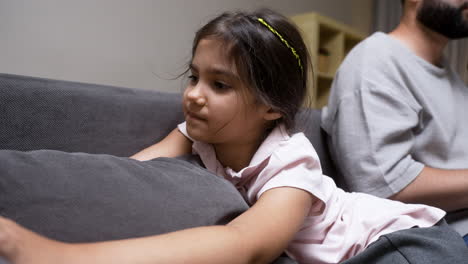 Close-up-view-of-little-girl-on-the-sofa