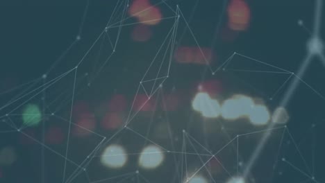 Animation of network of connections spinning against blurred view of night city traffic