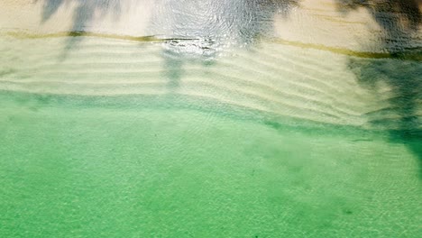 Aerial-view-of-clear-turquoise-sea-and-waves