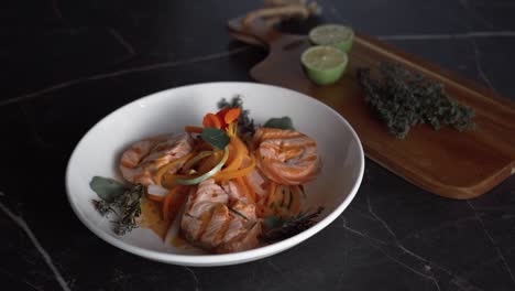 a plate featuring succulent grilled salmon fillet, perfectly complemented by a medley of finely chopped vegetables