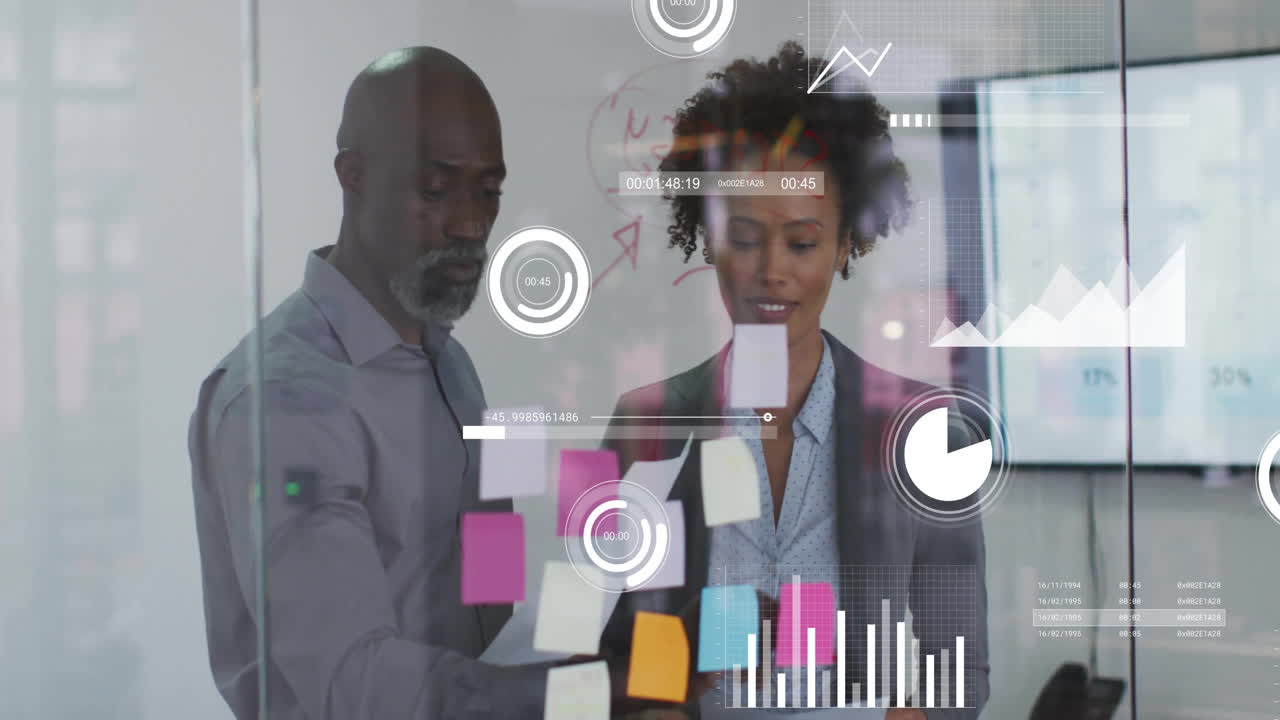 Animation of data processing and diagrams over diverse colleagues discussing work in office