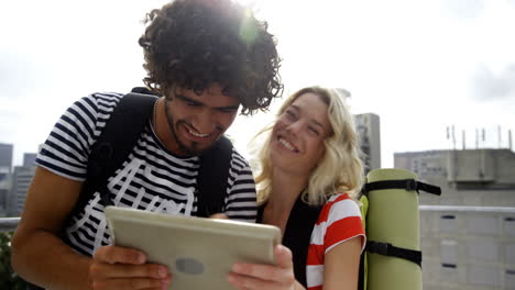 Young-couple-taking-a-selfie-with-digital-tablet-