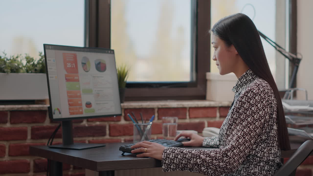 Business woman using computer and keyboard at work