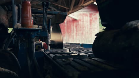 A-Gentleman-is-Getting-Ready-to-Process-Logs-at-a-Sawmill---Close-Up