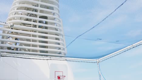 tilting down shot of empty mini basketball court on cruise ship