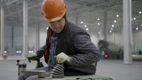 construction worker operating floor-polishing equipment