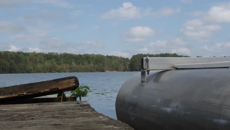 pontoon boat docked in lake drifting in the wind