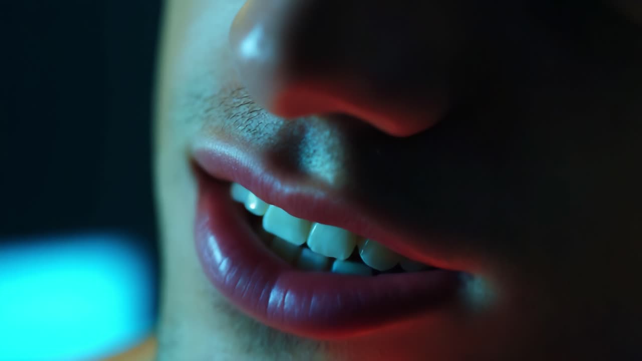 A Close-up Study of Expressions: Emphasis on a Person's Smile and Lips Illuminated by Soft Lighting, Capturing Subtle Details of Emotions and Texture in an Artistic Setting