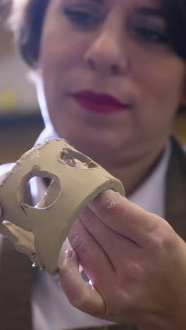 woman working on pottery project