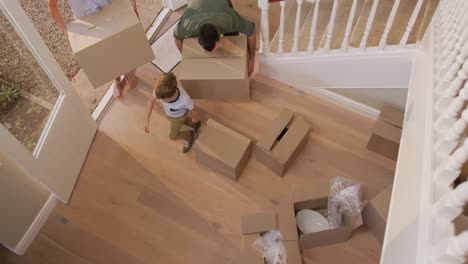 Caucasian-attractive-couple-moving-into-new-house