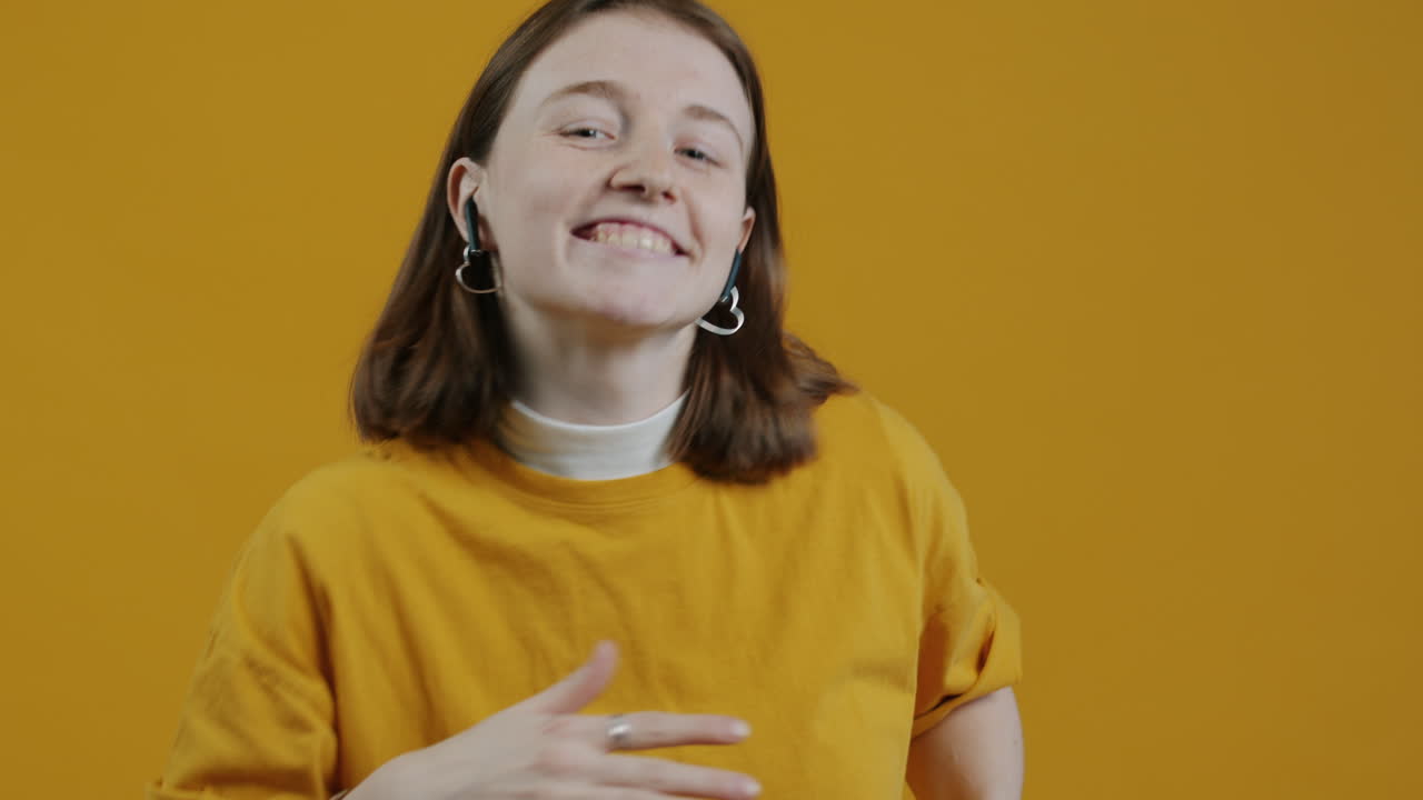 Happy young woman enjoying music on her phone