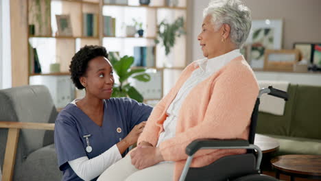 nurse assisting elderly woman in wheelchair