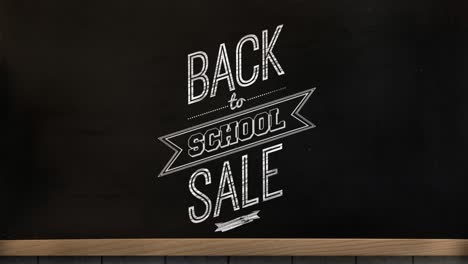 Animation-of-back-to-school-sale-text-over-blackboard-background