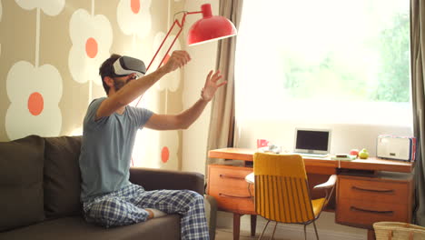 man experiencing virtual reality at home