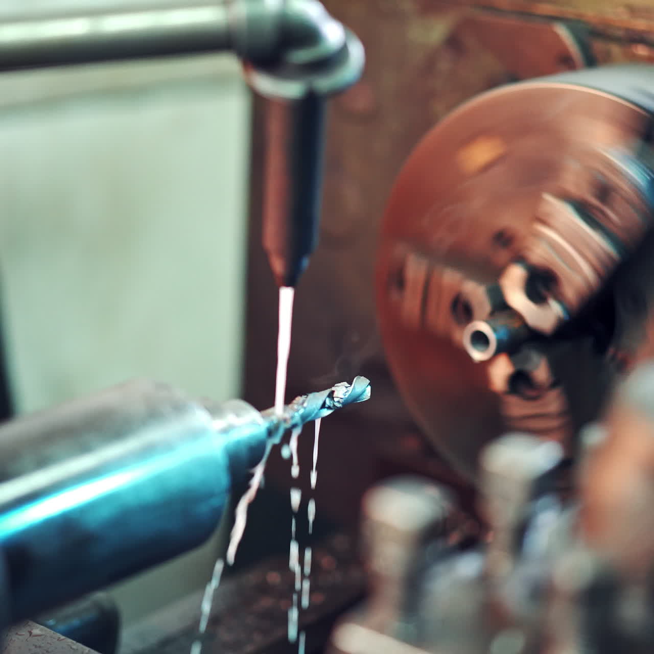 CNC milling machine in process on a factory. Metal working machine with cutter tool during turbine aluminium detail milling. Close-up