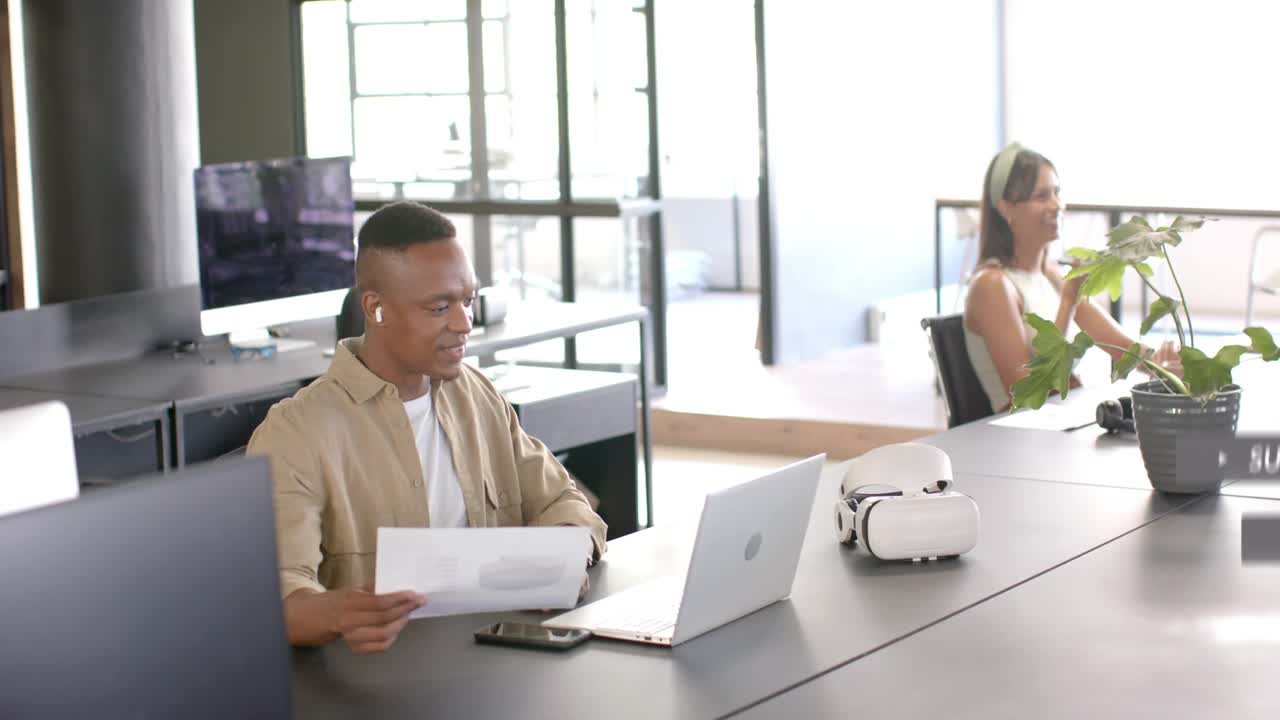 Man tapping phone at marketing desk promoting subs and likes popping over desk then fading